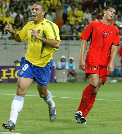 Brazil's goal scorer Ronaldo celebrates the second goal as he runs 