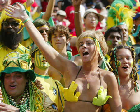 Brazil fans celebrate in the stands after their team beat Costa Rica 5-2 in their World Cup Finals match in Suwon June 13, 2002.