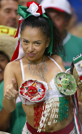 A Mexico fan wearing a sombrero bra in the stand at the World Cup Finals group G soccer match between Italy and Mexico in Oita June 13, 2002