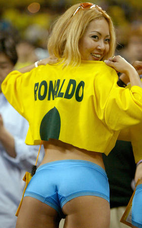 A Brazil fan displays her Ronaldo jersey (and cute blue shorts) in the stands before a World Cup semi-final match between Brazil and Turkey in Saitama June 26, 2002