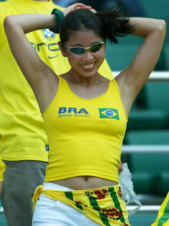 A Brazil soccer fan dances before a quarter-final match between Brazil and England at the World Cup finals in Shizuoka June 21, 2002